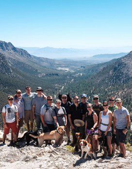 Resident giving thumbs-up Nellis Family Medicine Residency (FMR) residents on hilltop